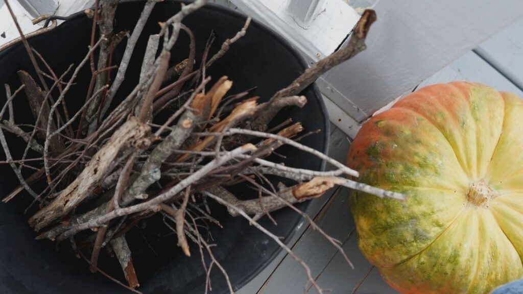 Fall Front Porch with pumpkins and kindling