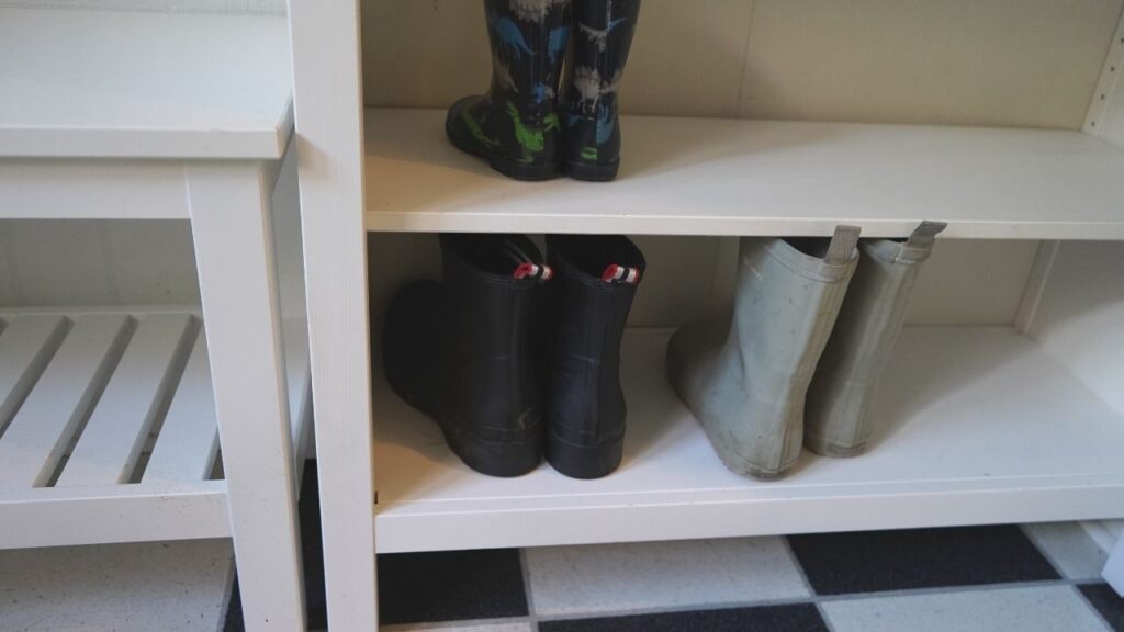 boots in a bookcase mudroom