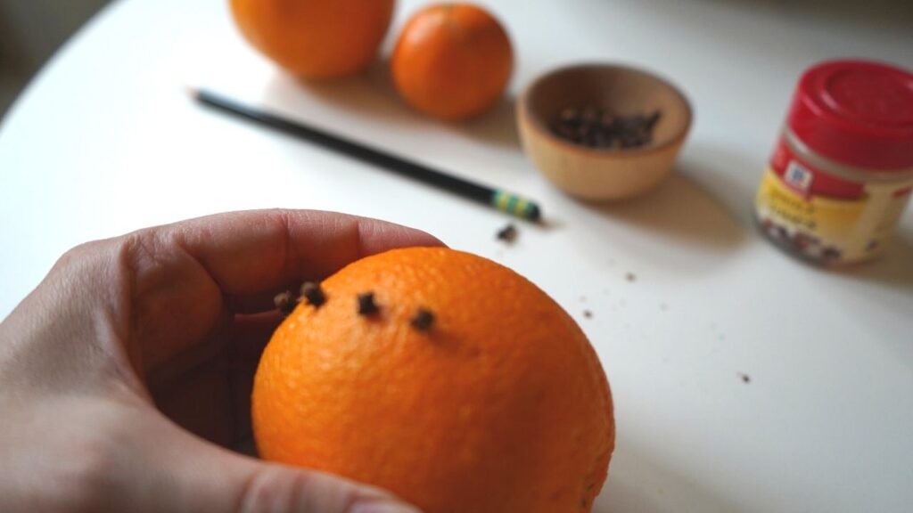 Adding cloves to orange